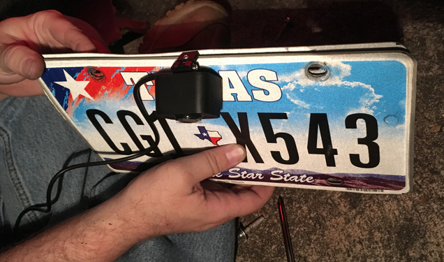 The joys of living in a city with terrible drivers: I used a spare, slightly smashed license plate to sandwich the camera bracket mounts and keep the sticky VHB plate off of a new, freshly painted rear bumper cover. This review was slightly delayed because I got rear-ended on the freeway again.